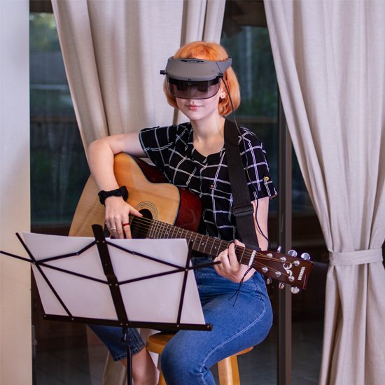 Acesight enables you to free your hands to do what you want, like playing guitar.